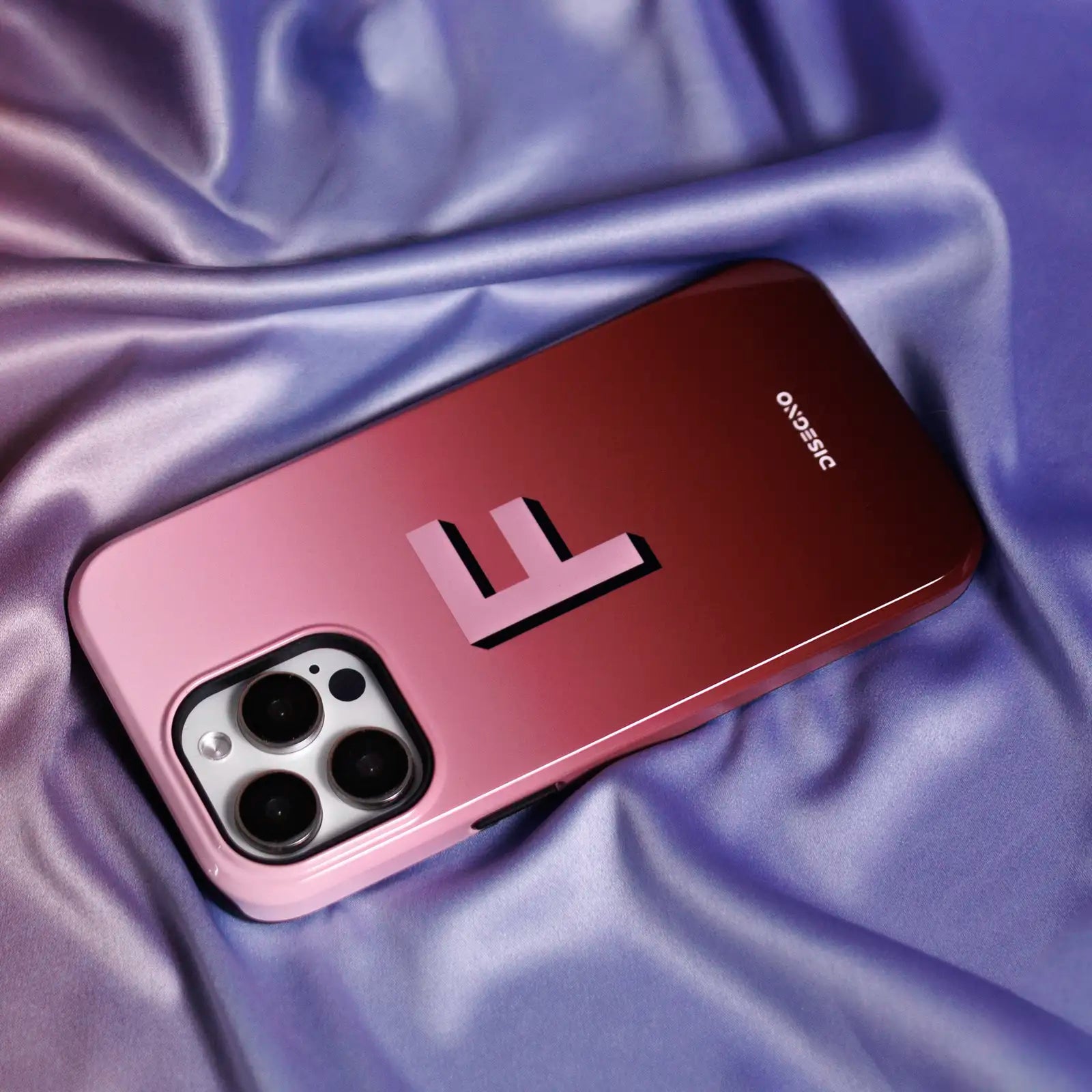 Rose tough MagSafe case personalized with shadow initial in pastel pink and navy blue